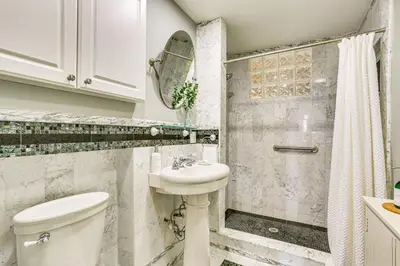 a bathroom with a toilet and a sink and a shower at Game Room, Yard and Fire Pit Spacious Catskills Gem in Sparrow Bush