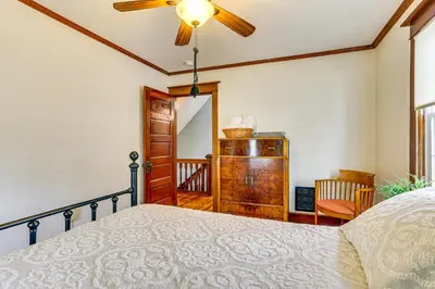 a bedroom with a bed and a ceiling fan at Game Room, Yard and Fire Pit Spacious Catskills Gem in Sparrow Bush