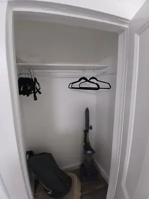 a closet with a pair of shoes on a shelf at Monthly Stays - 2BR Apt in Bloomfield - 8 Min Walk from NJ Transit in Bloomfield