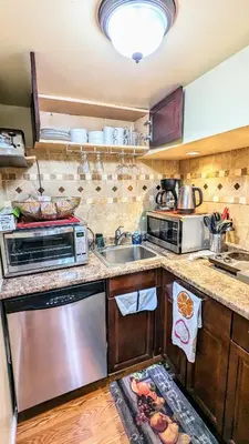 a kitchen with a sink and a stove at Charming Private 1BR Apartment with Easy NYC Access in Maplewood