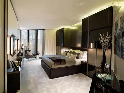 a bedroom with a large bed and a living room at Alerona in New York