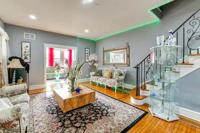 a living room with a couch and a table at 3 Mi to Penn Pet-Friendly Townhome in Yeadon! in Yeadon