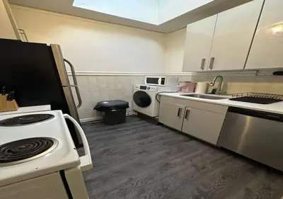 a kitchen with a sink and a stove top oven at Four Bedroom Prime Furnished Rental, June To Aug 90 Days Stay Required in New York