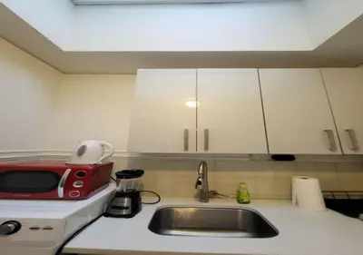 a kitchen with a sink and a red toaster at Four Bedroom Prime Furnished Rental, June To Aug 90 Days Stay Required in New York