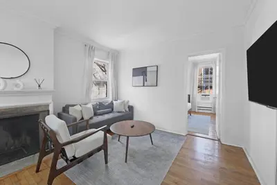 a living room with a couch and a table at Best Location in Greenwich Village in New York