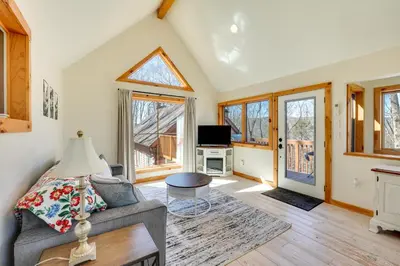 a living room with a couch and a table at Hike and Fish Outdoor Retreat Near Trails in Wurtsboro