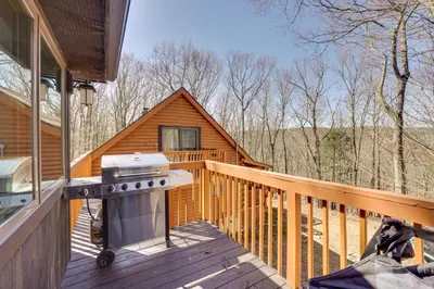 a grill on the deck of a cabin at Hike and Fish Outdoor Retreat Near Trails in Wurtsboro