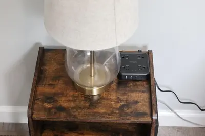 a lamp on a wooden table with a lamp on it at 8BR 4BA Home Near NYC -Sleeps 16 in Irvington