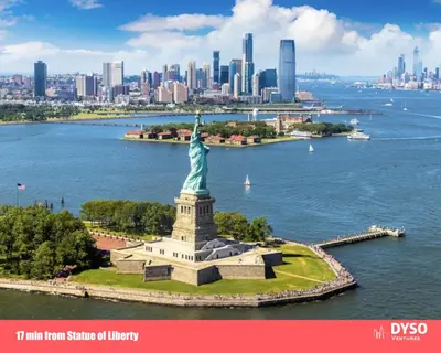 an aerial view of the statue of liberty in front of the city at Private Studio 5 minutes to the NYC train in Bayonne