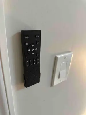 a black remote control is attached to a wall at 3Bed 2Bath Apt Near NYC plus Parking and Laundry in Irvington
