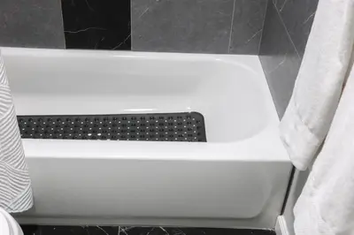 a white bath tub in a bathroom with a shower curtain at 5Bed 2Bath Near NYC, Parking, Laundry in Irvington