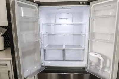 an empty refrigerator with its door open in a kitchen at 5Bed 2Bath Near NYC, Parking, Laundry in Irvington