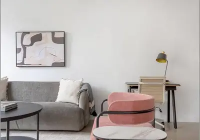 a living room with a couch and a chair at 3BR Furnished Loft in Midtown West in New York
