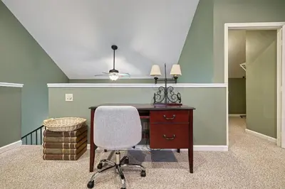 an office with a desk and a chair at Suites On Chocolate - The School in Hershey