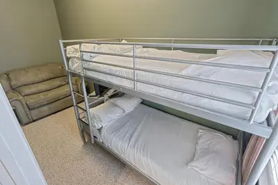 a couple of bunk beds in a room at Suites On Chocolate - The School in Hershey