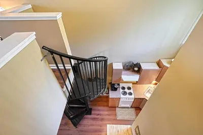 a room with a staircase with boxes on the floor at Suites On Chocolate - The Theater in Hershey