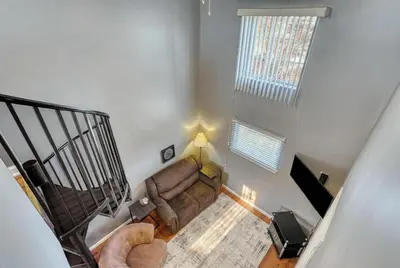 an overhead view of a living room with a couch at Suites On Chocolate - The Factory in Hershey