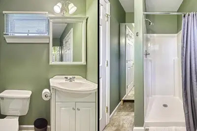 a bathroom with a sink and a toilet and a shower at Suites On Chocolate - The Zoo in Hershey