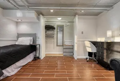 a bedroom with a bed and a desk and a chair at Suites On Chocolate - The Studio in Hershey