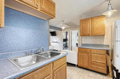 a kitchen with a sink and a tub at Suites On Chocolate - The Annville Cottage in Annville