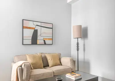 a living room with a couch and a table at Midtown West 2 Bedroom Furnished Apartment Rental in New York
