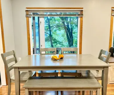 a dining room table with a banana peel on it at Cayuga lake cottage with private lake access in Washingtonville