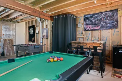 a billiard room with a pool table and a bar at Hot Tub Fire-place Game Room Arrowhead Lake in Thornhurst