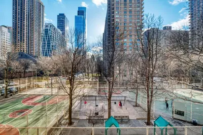 a park in the middle of a city at UWS 2br w wd doorman gym nr Central Park NYC-1082 in New York