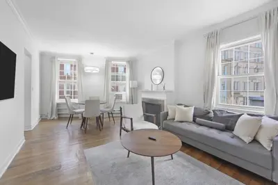 a living room with a couch and a table at Best Location in Greenwich Village in New York