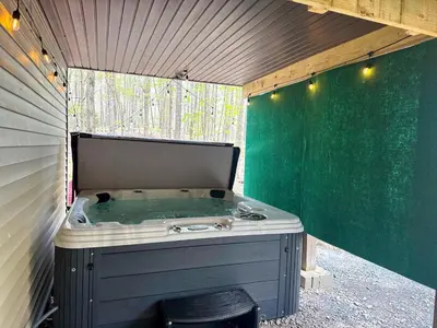 a jacuzziificialificialificialificialificialificialificialificialificialificialificial at Grand Woodland Retreat - Hot Tub - Game Room in Gouldsboro