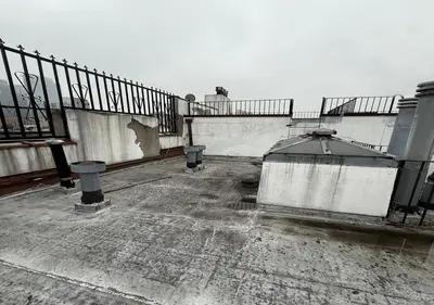 an abandoned building with a fence and stairs on it at Midtown West 3 Bedroom Washer dryer and Dishwasher, June to Aug 90 days stay required in New York
