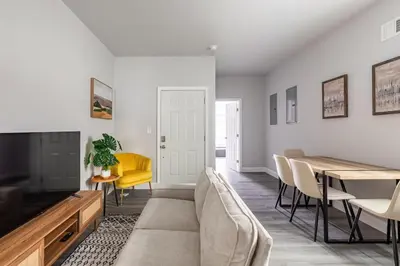 a living room with a couch and a table at Philly Getaway - Chic Stay Near Center City in Philadelphia