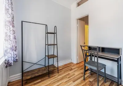 a room with a ladder and a desk and a chair at Chelsea 2BR Gem! in New York