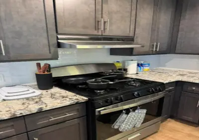 a kitchen with a stove and a counter top at Newly Reno 1BR! Murray Hill! in New York