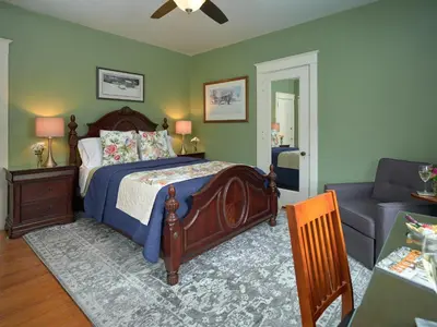 a bedroom with a bed and a couch at Mooreland Garden Inn in Carlisle