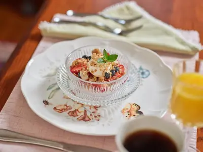 a dessert in a glass bowl on a plate on a table at Mooreland Garden Inn in Carlisle