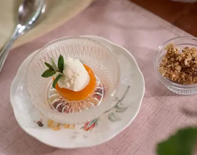 a dessert in a glass bowl on a plate on a table at Mooreland Garden Inn in Carlisle