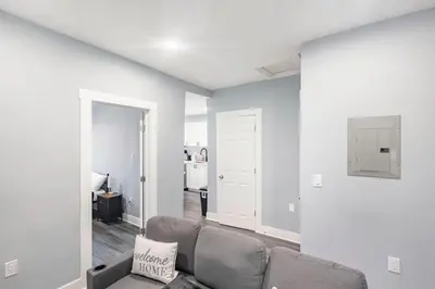 a living room with a couch and a table at Prime Location Explore NYC in West New York