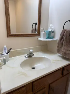 a bathroom counter with a sink and a mirror at Town House near Geisinger Medical Center in Danville