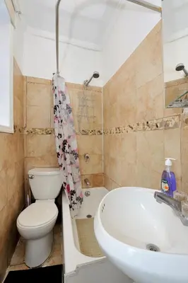 a bathroom with a sink and a toilet and a sink at Charming 2BR Apartment Near Times Square in New York