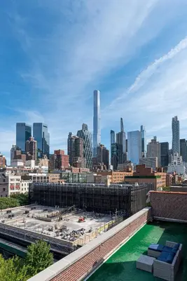 a view of a city skyline with a building under construction at Amazing Furnished 1 BR Penthouse Midtown West in New York