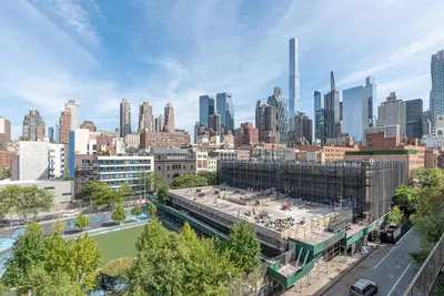 a view of a city skyline with buildings at Amazing Furnished 1 BR Penthouse Midtown West in New York