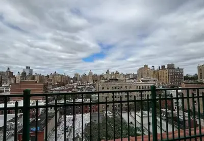 a view of a city from a balcony at Amazing Studio in Kips Bay in New York