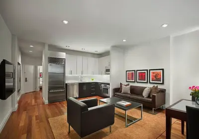 a living room with a couch and a table at XL Prime Tribeca Furnished Loft in New York
