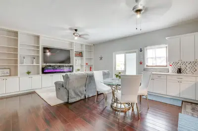 a kitchen and living room with a table and chairs at 5 Mi to Rutgers University New Jersey Guest Suite in South River