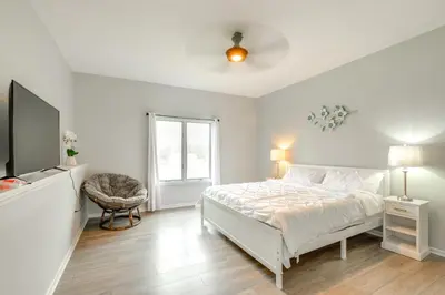 a white bedroom with a bed and a tv at 5 Mi to Rutgers University New Jersey Guest Suite in South River