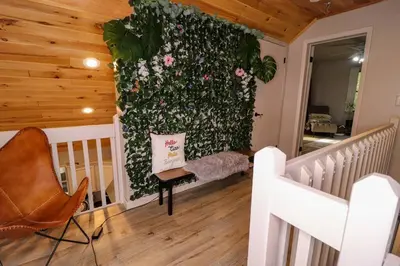 a room with a wall covered in flowers at Villa MiaNova A Modern Hideout in the Woods in Lake Ariel