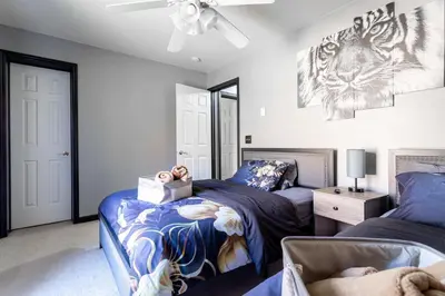 a bedroom with two beds and a ceiling fan at Hot Tub Game Room Fenced Yard Dog Friendly in Albrightsville