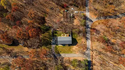 an overhead view of a house on a hill at Hot Tub Game Room Fenced Yard Dog Friendly in Albrightsville