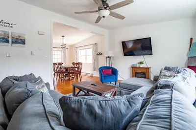a living room with a couch and a table at My Blue Haven Game Area 4 BDR Pet Friendly in Albrightsville